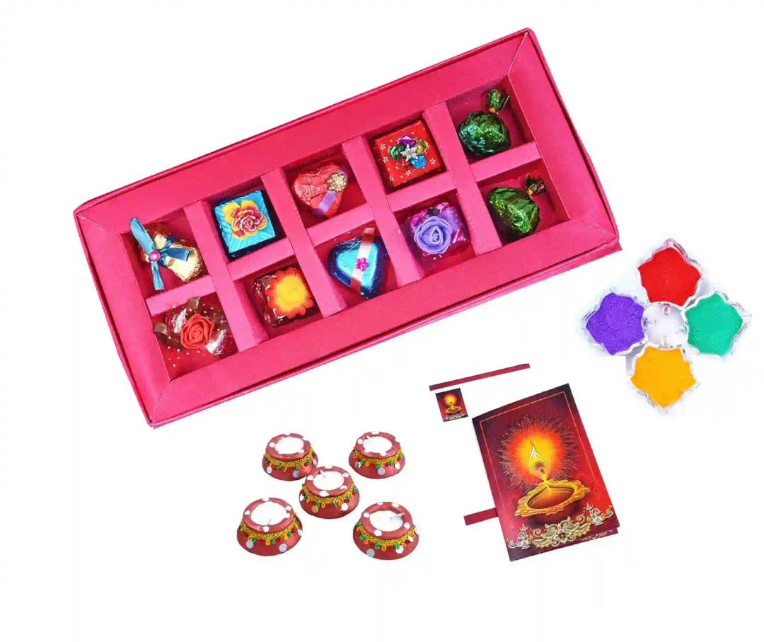 MANTOUSS Diwali Chocolate Gift in Premium Pink Satin Box + 2 Matki Wax Filled Diya, Diwali Greeting Card and Rangoli Colours